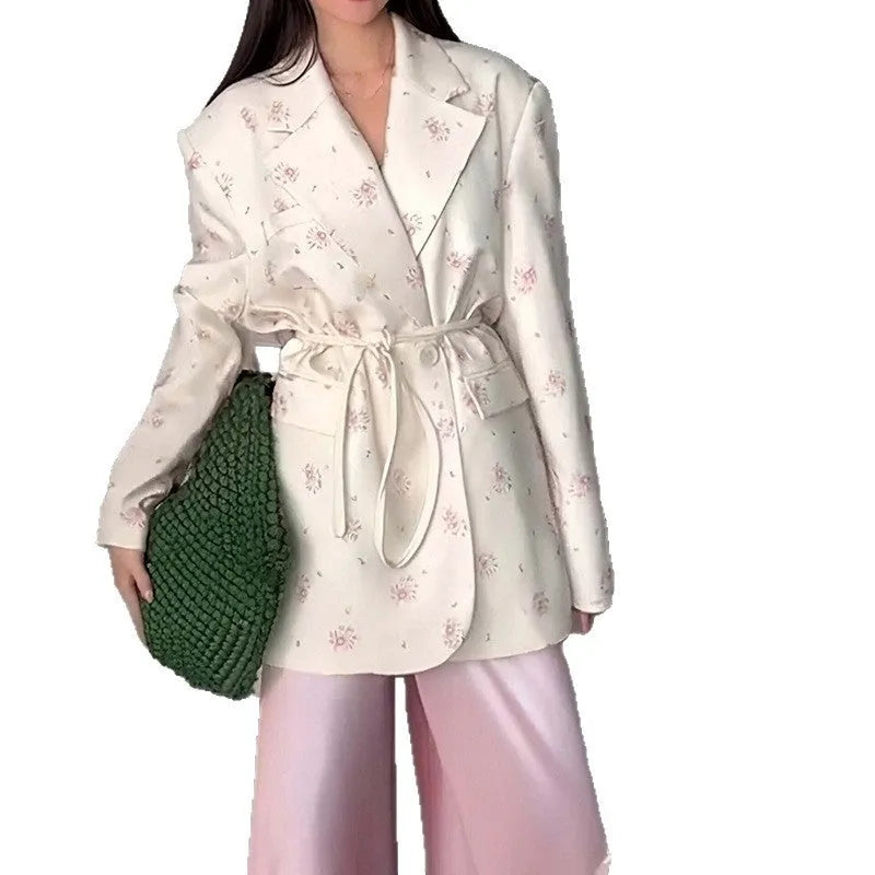 Women's suit jacket with lace-up waist detail in polyester fabric, shown in apricot colour