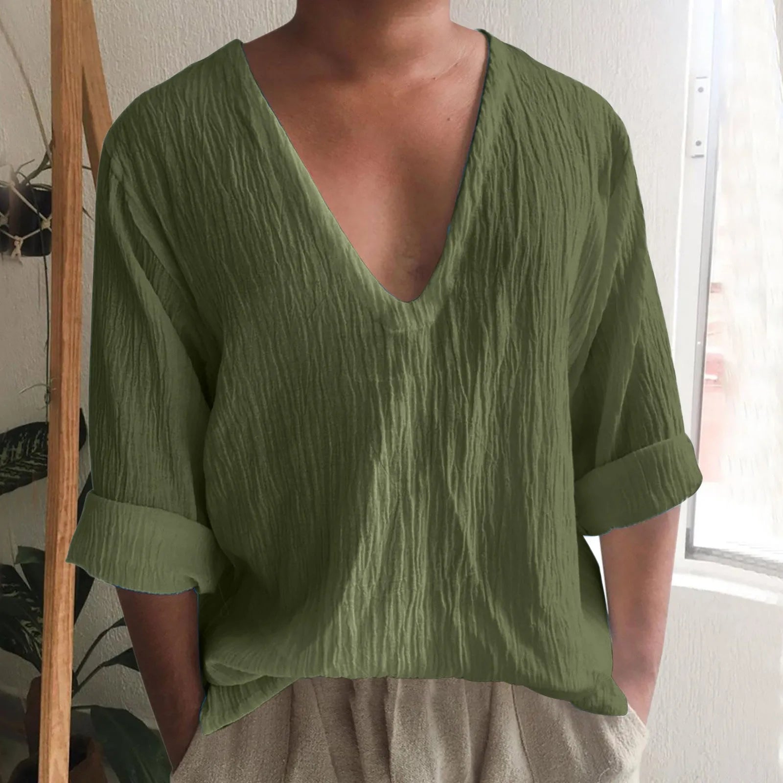 Men's solid colour V-neck long sleeve t-shirt in washed cotton fabric on a hanger