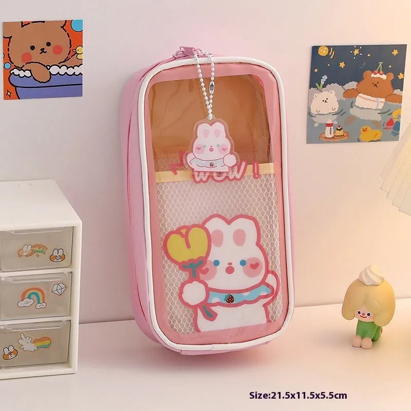 Large transparent PVC pencil case with cartoon bear, rabbit, and dog designs for student stationery.