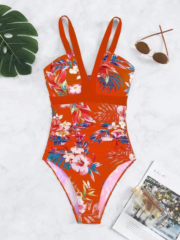 Women's black floral backless one-piece swimsuit on a mannequin