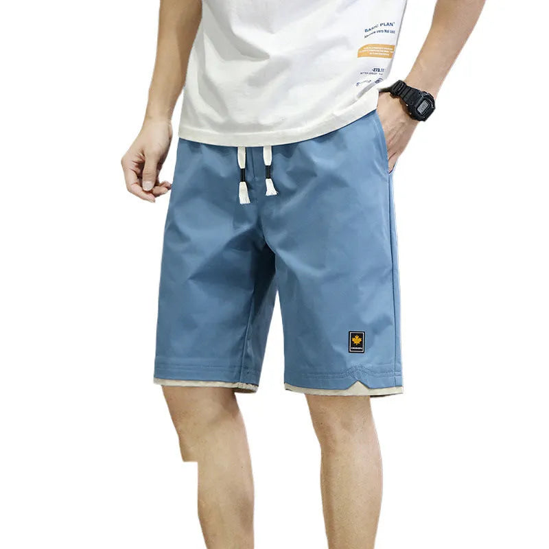 Men's loose-fit casual shorts in khaki colour with elastic waistband, shown on a neutral background.