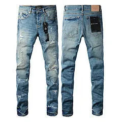 Black slim fit skinny jeans with straight leg, button fly, and manual distressing detail.