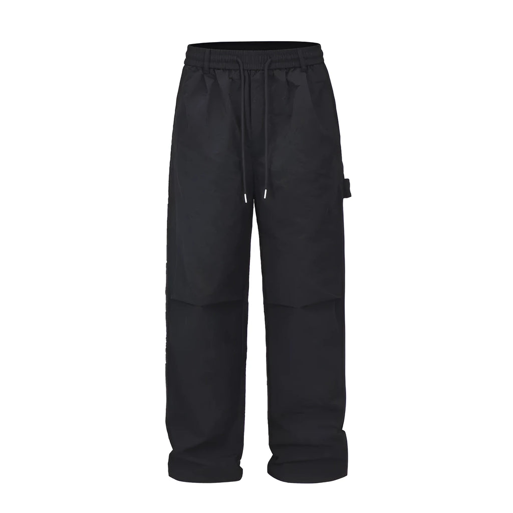 Black paratrooper trousers with elastic drawstring waist and three-dimensional cutting in baggy style