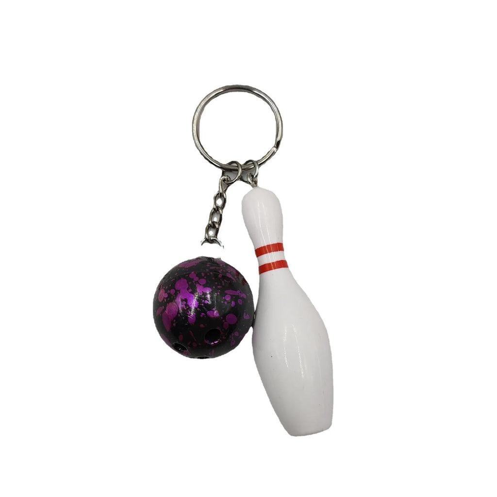 Mini bowling pin simulation keychain pendant in blue, made from PVC and metal on a key ring.