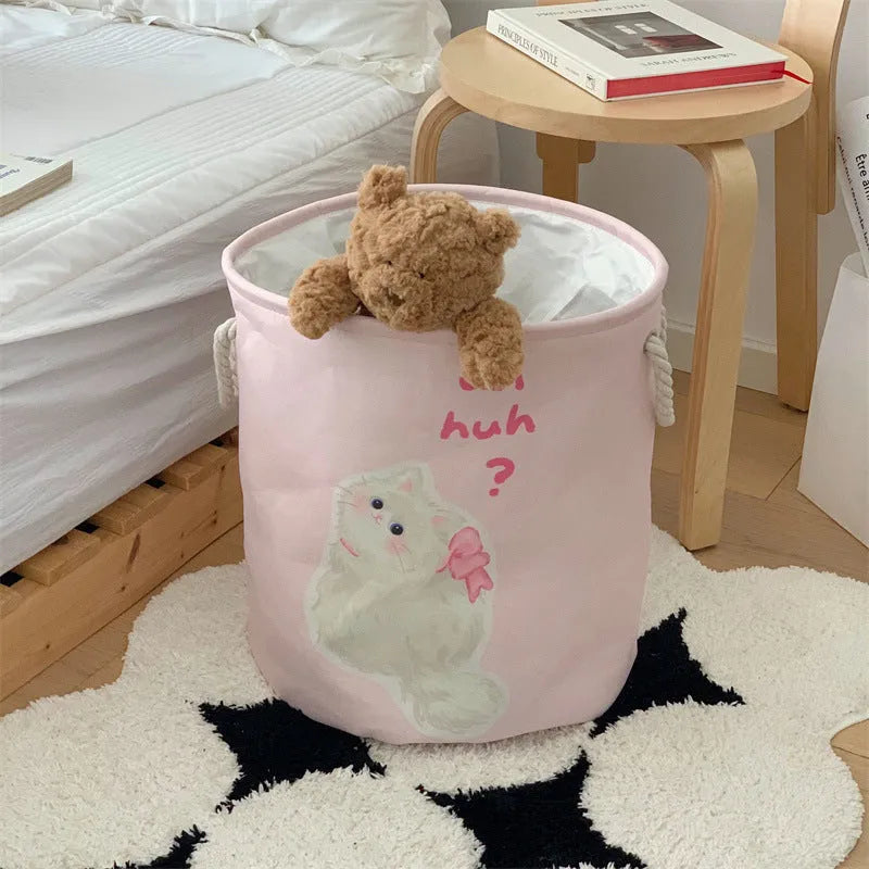 Foldable cotton laundry basket in a colourful design, shown unfolded for use.