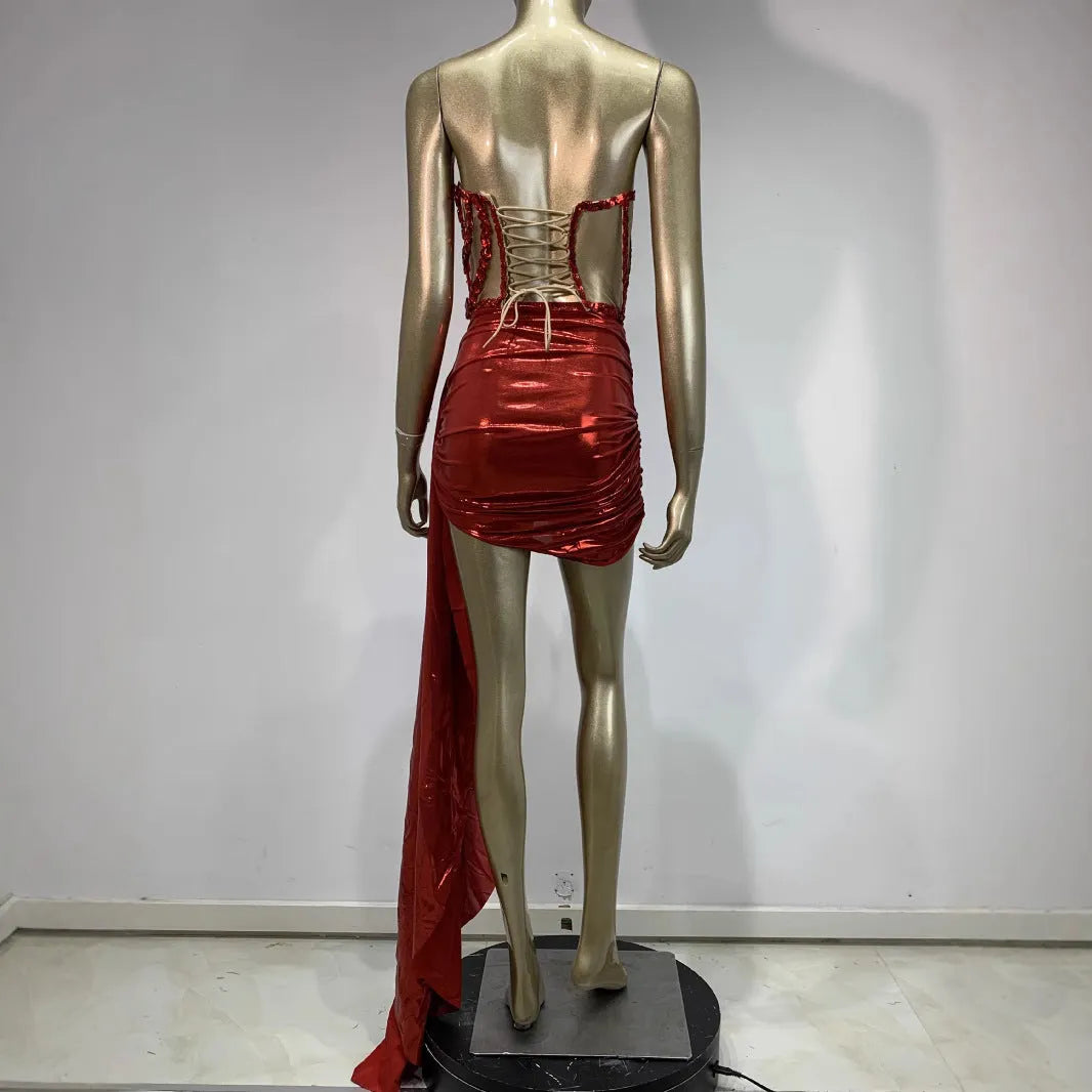 Red women's skirt suit with see-through mesh panels, made from stretch spandex fabric.
