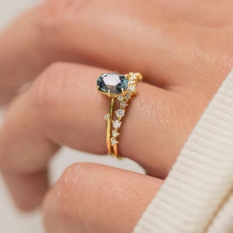 Gold plated floral ring with green zircon stones in women's fashion jewellery design