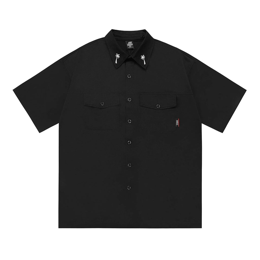 Men's black loose fit cotton blend pocket shirt with half sleeves and embroidered detail on a hanger.