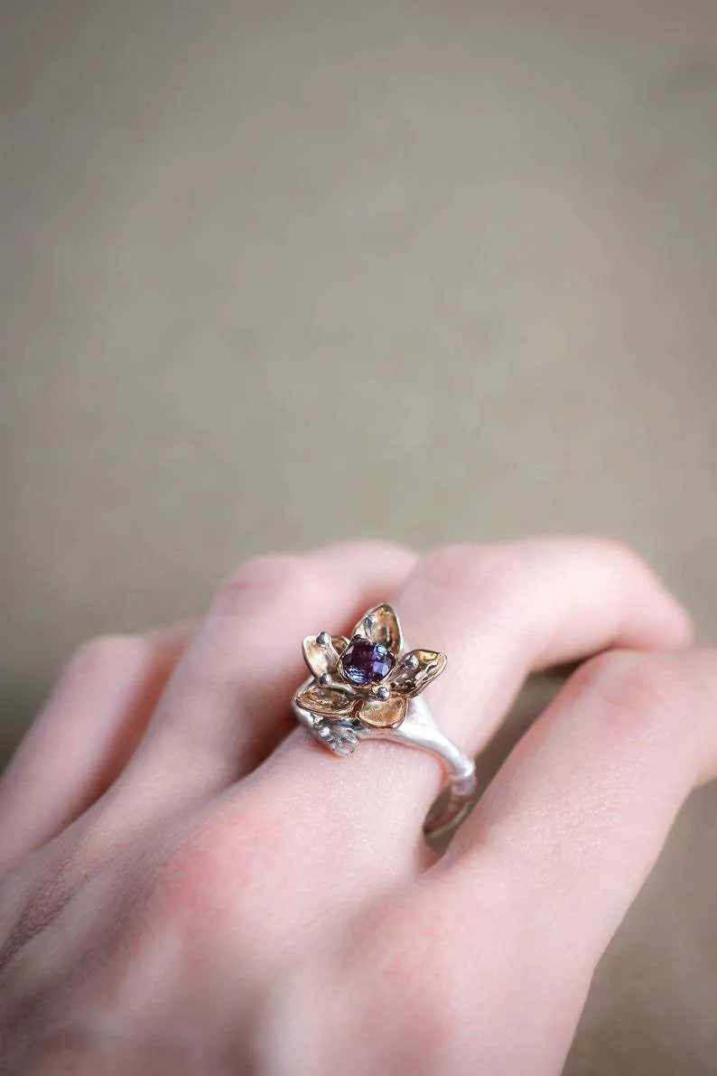 Silver two-tone floral geometric women's ring showing alloy construction and contemporary design