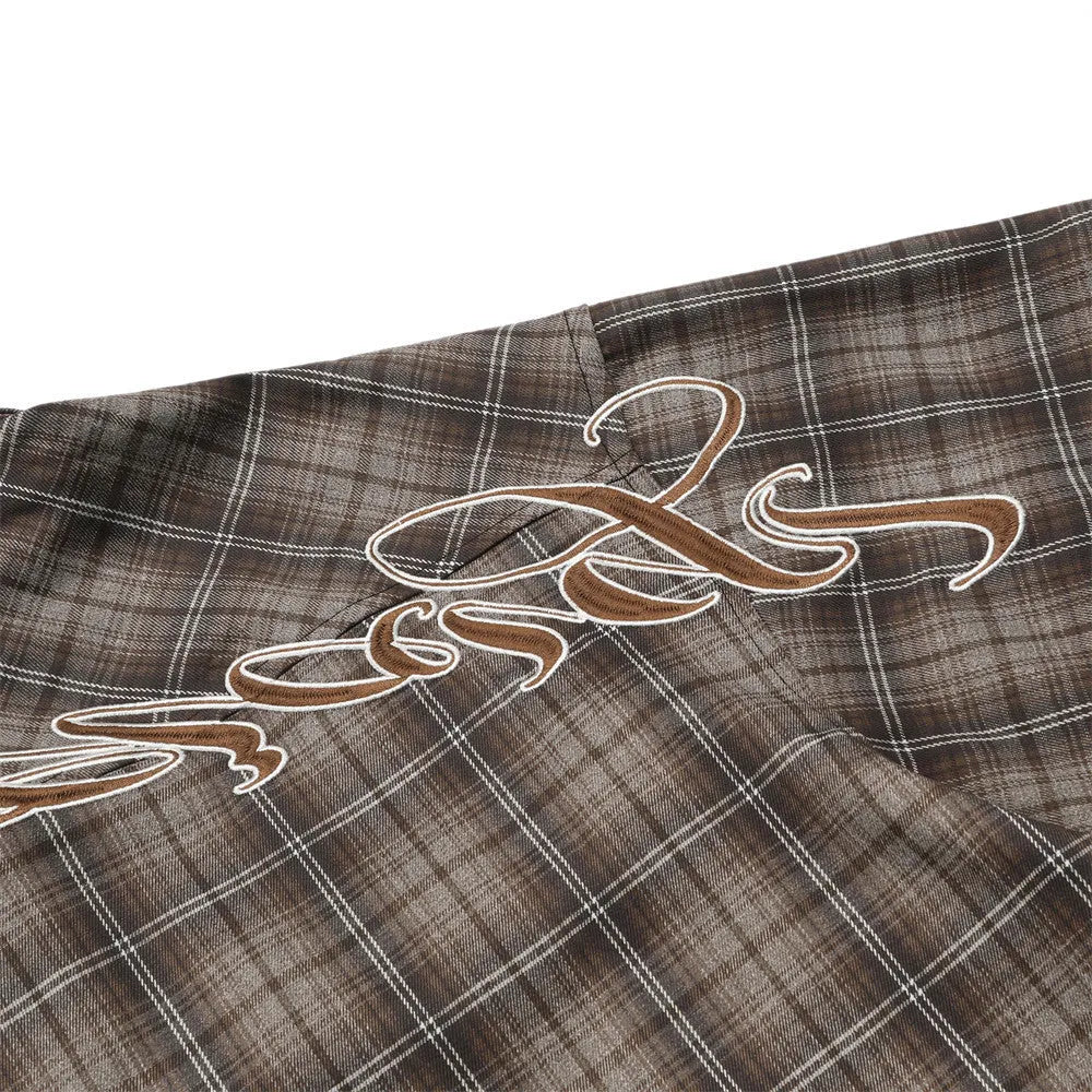Men's black and brown plaid short sleeve shirt with embroidered letter detailing on the front