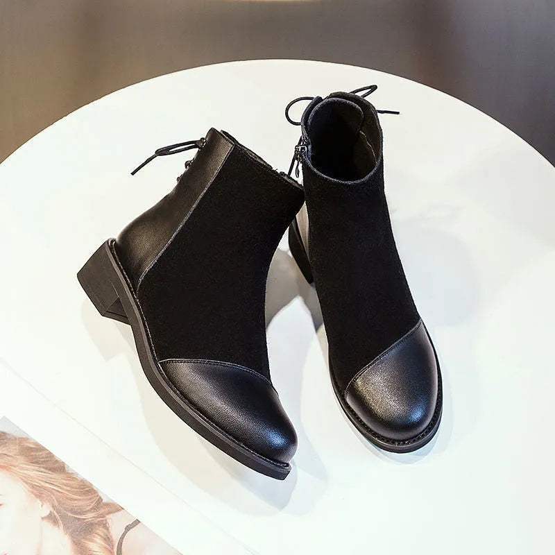 Women's black knee-high Martin boots with side zip and bow detail