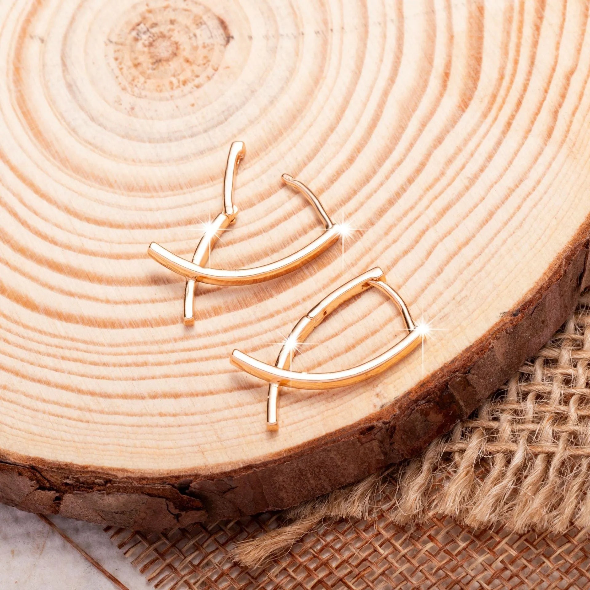 Rose gold cross shaped earrings with polished finish on copper material