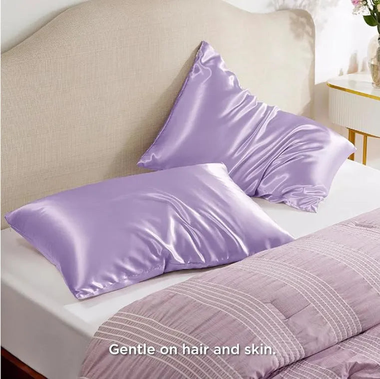A pair of solid colour satin pillowcases in a chosen shade, showing the smooth plain weave fabric texture.