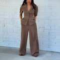 Brown men's two-piece polyester suit set with slim-fit waist, showing long-sleeved top and full-length trousers.