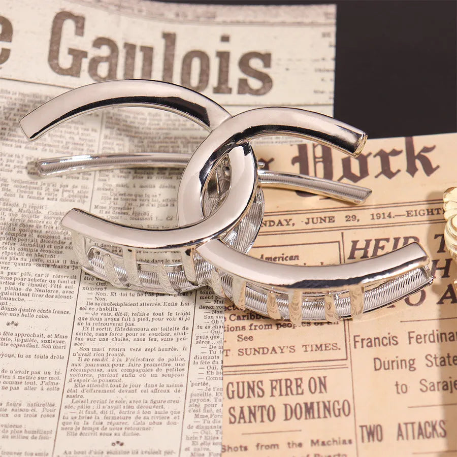 Silver metal hair barrette claw clip with electroplated finish and decorative design