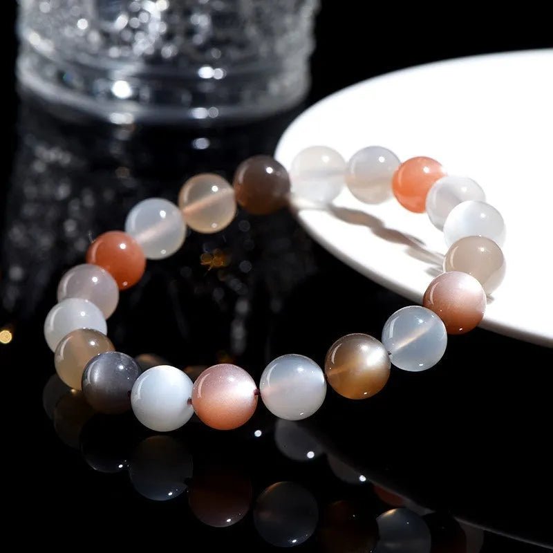 Natural moonstone colourful moonlight bracelet with 8mm beads in a single circle on a wrist.