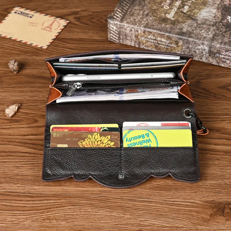 Retro brown embossed floral pattern tri-fold women's wallet made of genuine cowhide leather.