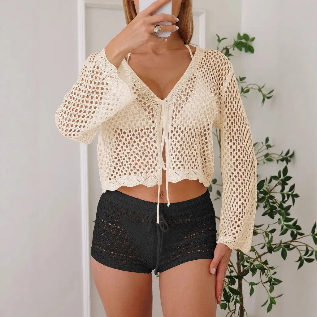Short women's cardigan blouse with bell sleeves in hollow woven imitation cotton fabric.