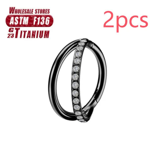 Titanium alloy nose ring on a plain background, shown in silver and gold finishes.