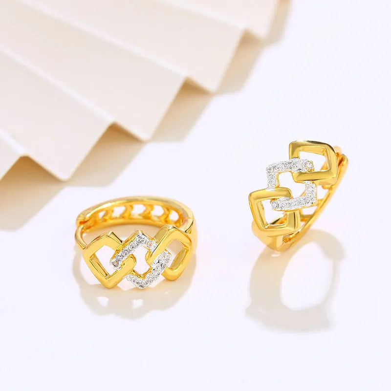 Gold geometric hollow out earrings with electroplated finish at ear clip area