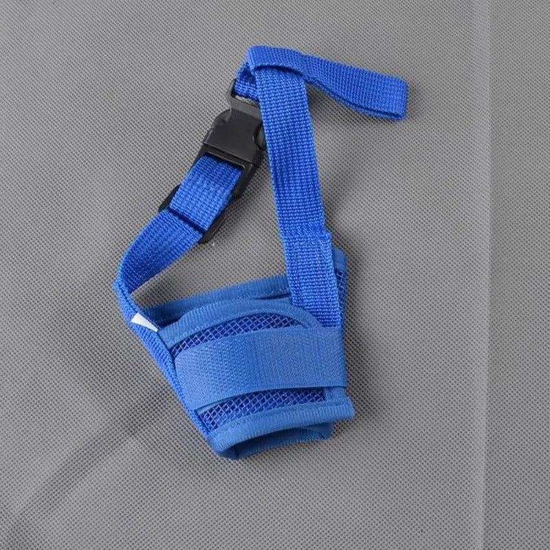 Adjustable plastic basket-style dog muzzle in red, shown on a dog's snout with quick-release buckle.