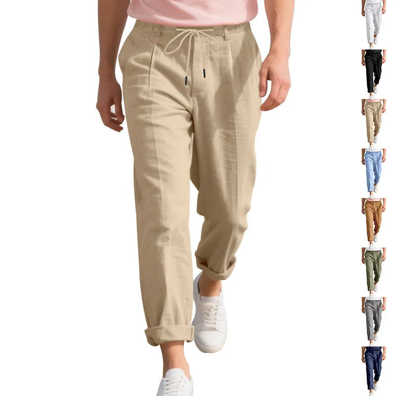 Men's light beige linen casual trousers with drawstring waist and straight-leg fit on a hanger.