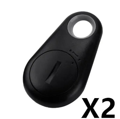 Small black Bluetooth tracker on a keyring with white logo and rounded edges