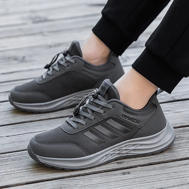 Casual unisex slip-on shoe with mesh upper and black elastic band fastening on a non-slip sole.