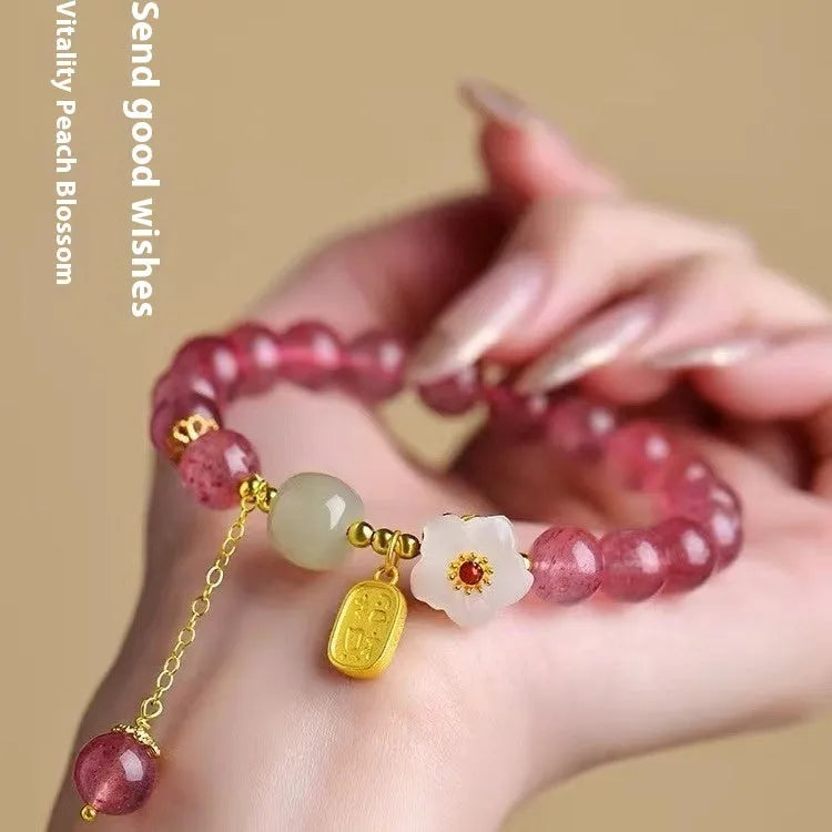 Handmade natural strawberry quartz crystal bracelet for women with moon and pearl bead designs.