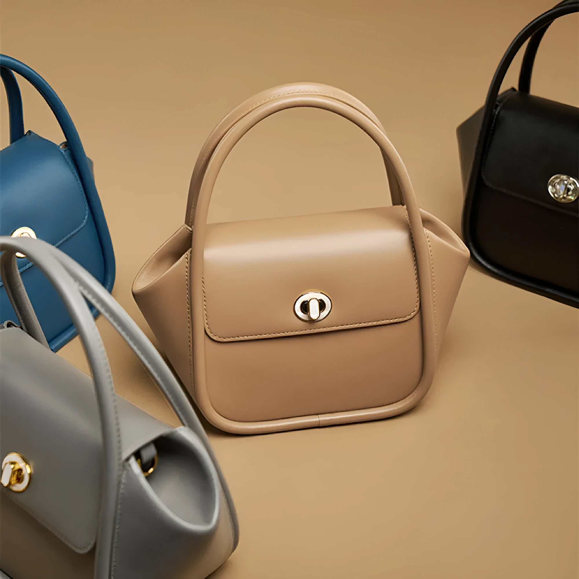 Leather wing bag with latch closure and buckle detailing in cow leather with cross-body strap