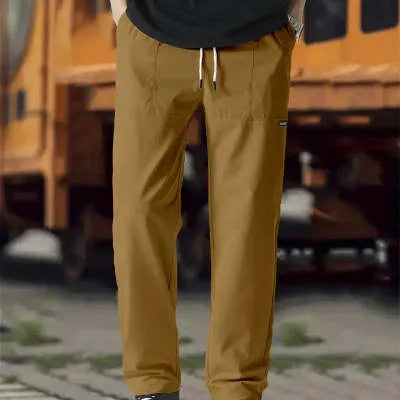 Men's polyester trousers for spring and autumn in light grey, shown flat.