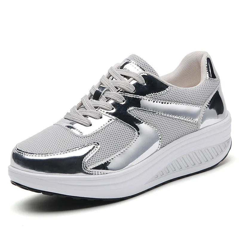 Women's gold platform trainers with mesh upper, cross-strap design and waterproof platform