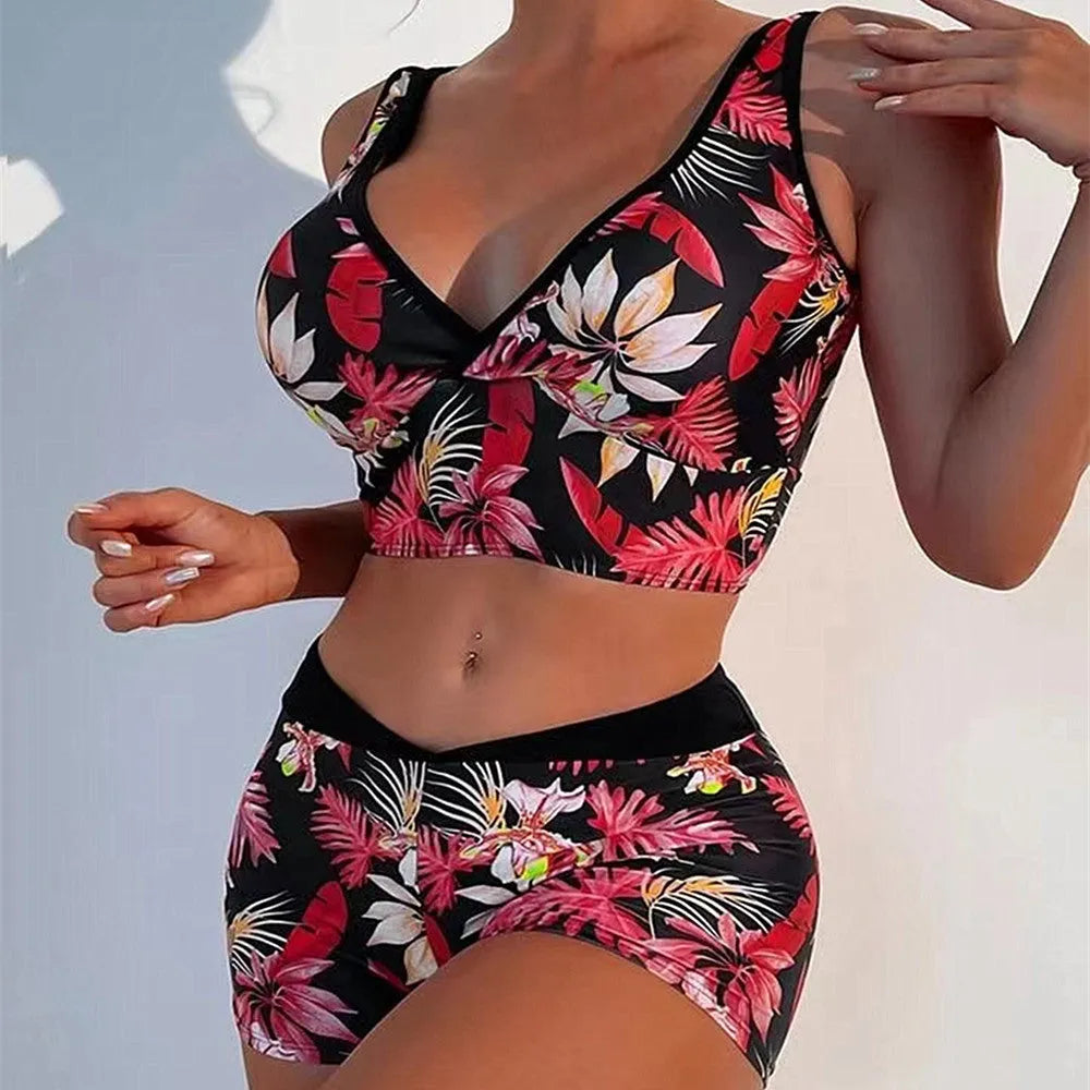 Women's two-piece printed swimsuit set with sleeveless top and boxer shorts in a multi-colour design.