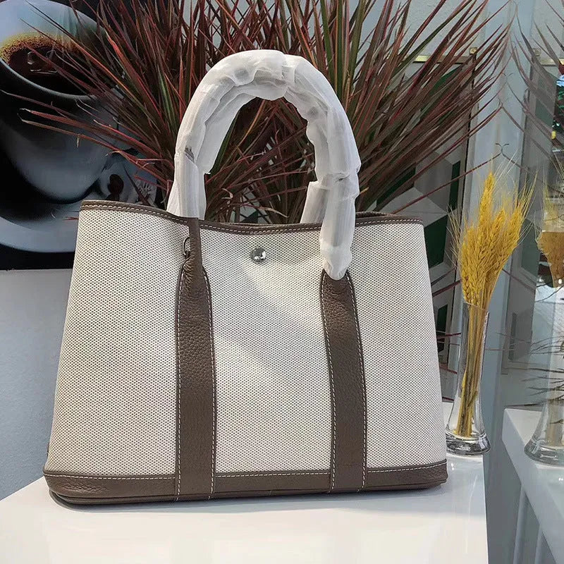 Genuine leather crossbody bucket tote bag with canvas surface in multiple colour options
