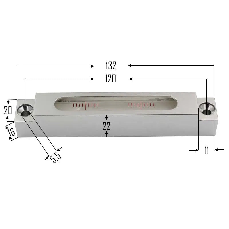 Small silver metal spirit level with glass vials on a workshop bench