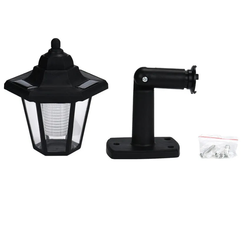 Black hexagonal solar-powered outdoor wall lamp with light sensor and IP44 waterproof rating
