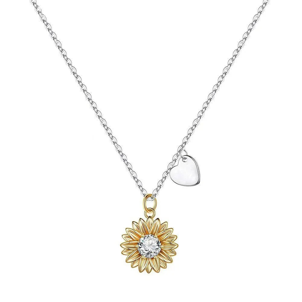 Sterling silver sunflower necklace with geometric daisy petal pendant on an adjustable cross chain.