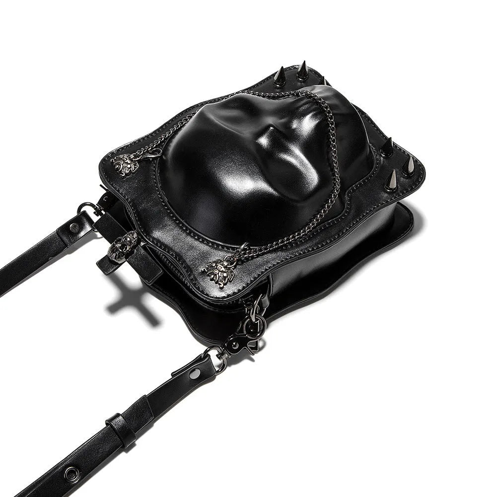 Black Gothic skull crossbody bag with square shape, chain detail, and zipper opening