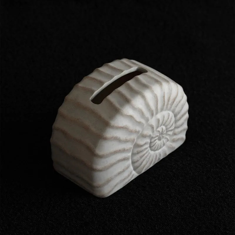 A modern conch ramble coloured resin tissue box for home or office desk organisation.
