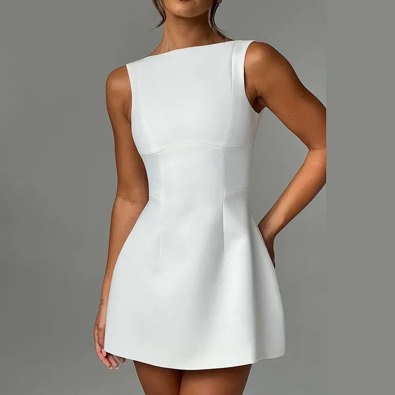 Slim-fitting backless sling dress with high waist and short skirt in a choice of colours.