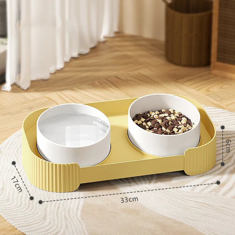 Green ceramic raised pet feeder with two tilted bowls on a non-slip stand
