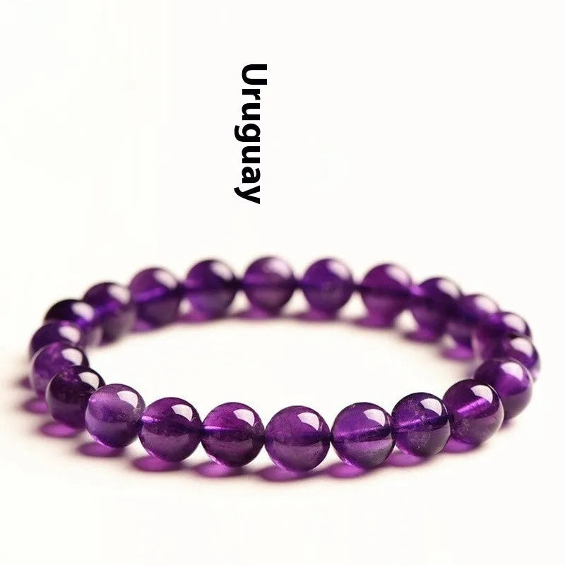 Natural amethyst Uruguay bracelet with scattered beads in various sizes on a wrist.