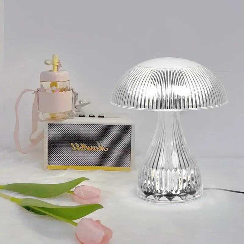 Rechargeable touch night lamp with acrylic body on a plastic base, showing three LED light colours.