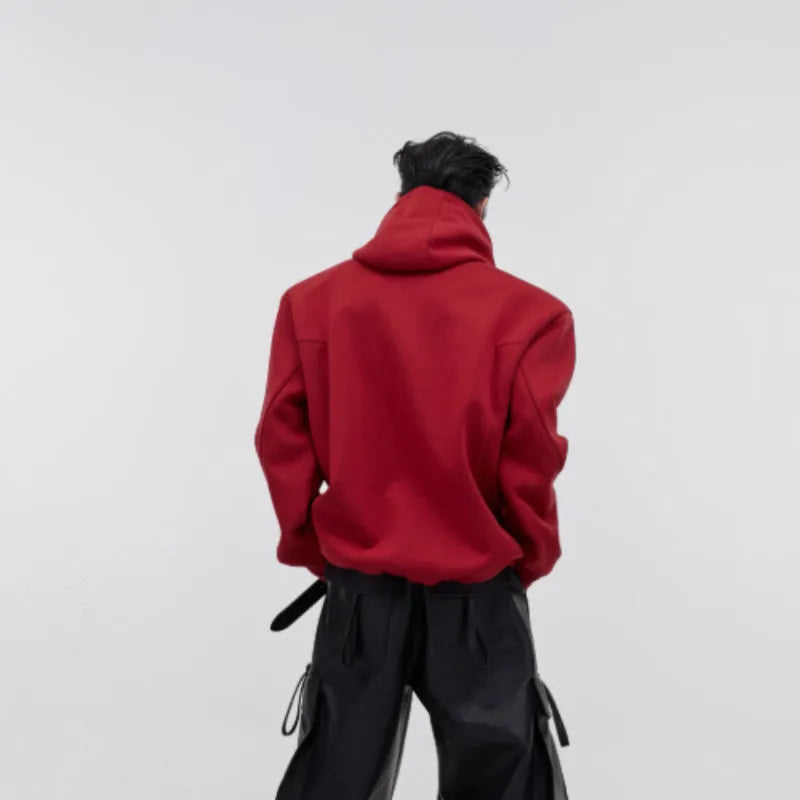 Red men's hooded sweater with heavy shoulder pads and 3D printing detail on a loose fit.