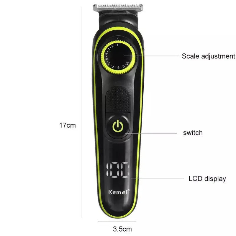 Black KM-696 USB rechargeable electric hair clipper set with stainless steel blades and accessories on a cloth