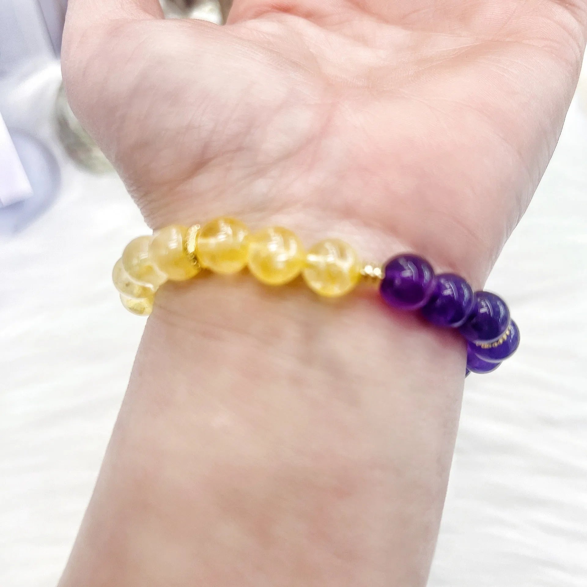 Handmade women's yellow and purple amethyst crystal bracelet with secure clasp fastening