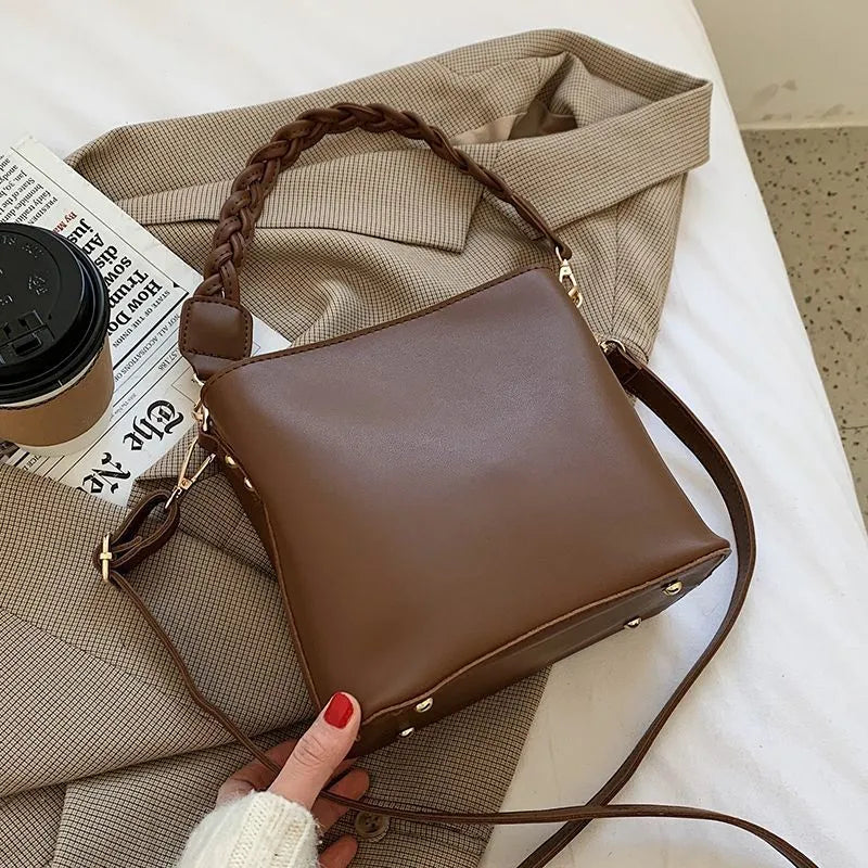 Retro woven PU bucket bag in khaki colour shown as crossbody and underarm bag
