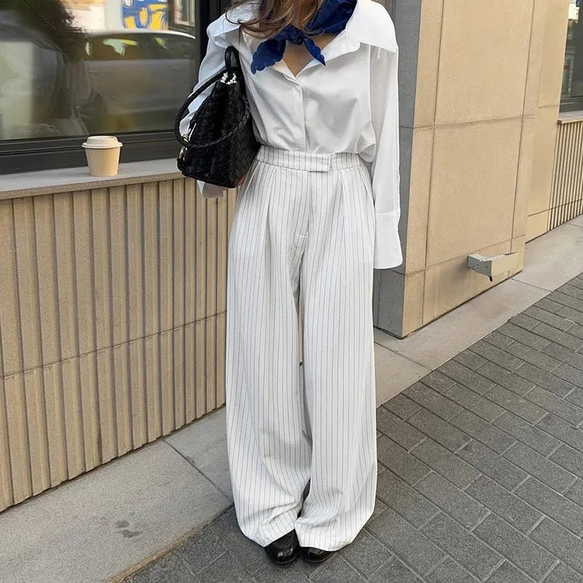 White striped wide-leg women's trousers with zipper, loose fit for commuting.