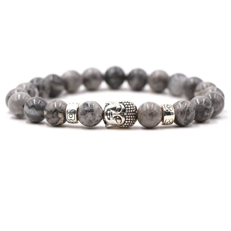 Tigereye stone Buddha head stretch bracelet with 8mm beads on a wrist.