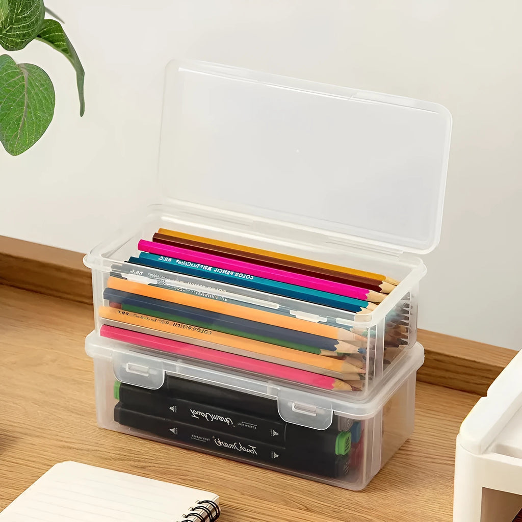 Large clear plastic pencil storage box filled with colouring pencils and crayons.